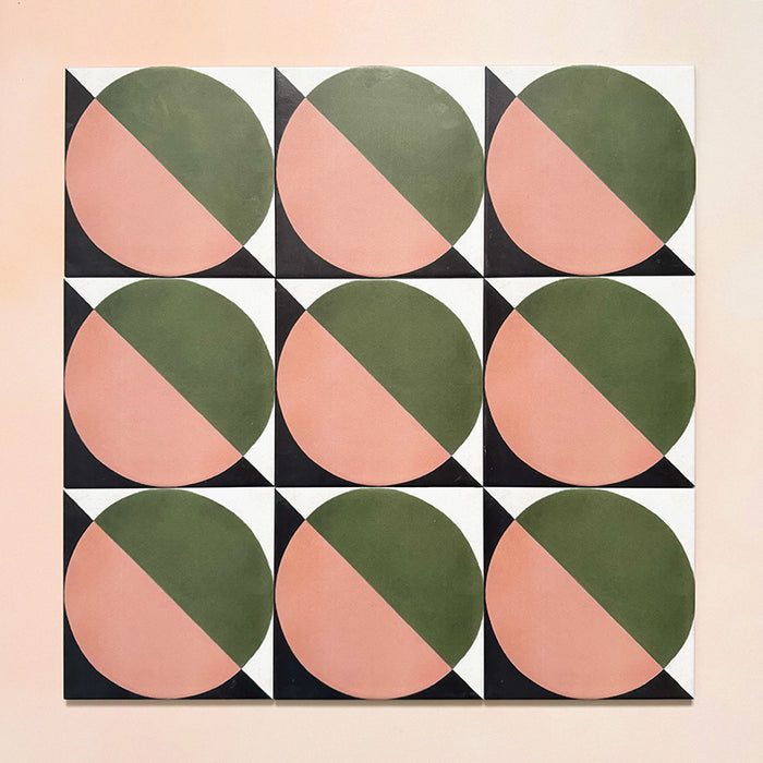 Group image showing nine Geometry Moon 20x20cm geometric patterned tiles arranged in a grid, featuring green and terracotta semicircles with black and cream corner details, photographed against a soft peach-toned background.