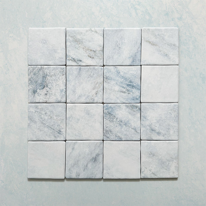 Product image of Giovanni Square Azul Vintage Marble wall and floor tiles in an 11cm x 11cm format, featuring soft blue and white marble effect detailing, subtle veining and rounded vintage-inspired edges.