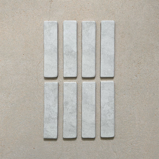 Product image of Giovanni Brick Carrara Vintage Marble wall and floor tiles in a 5.4cm x 22cm format, featuring a soft white marble effect surface with subtle tonal variation and rounded vintage-inspired edges.