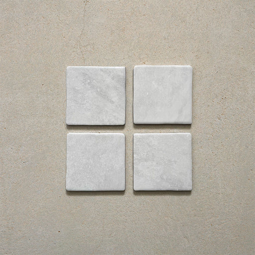 Product image of Giovanni Square Carrara Vintage Marble wall and floor tiles in an 11cm x 11cm format, featuring a soft white marble effect surface with subtle tonal variation and rounded vintage-inspired edges.