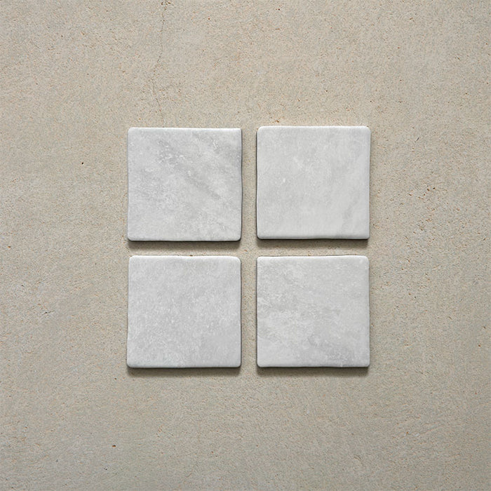Product image of Giovanni Square Carrara Vintage Marble wall and floor tiles in an 11cm x 11cm format, featuring a soft white marble effect surface with subtle tonal variation and rounded vintage-inspired edges.