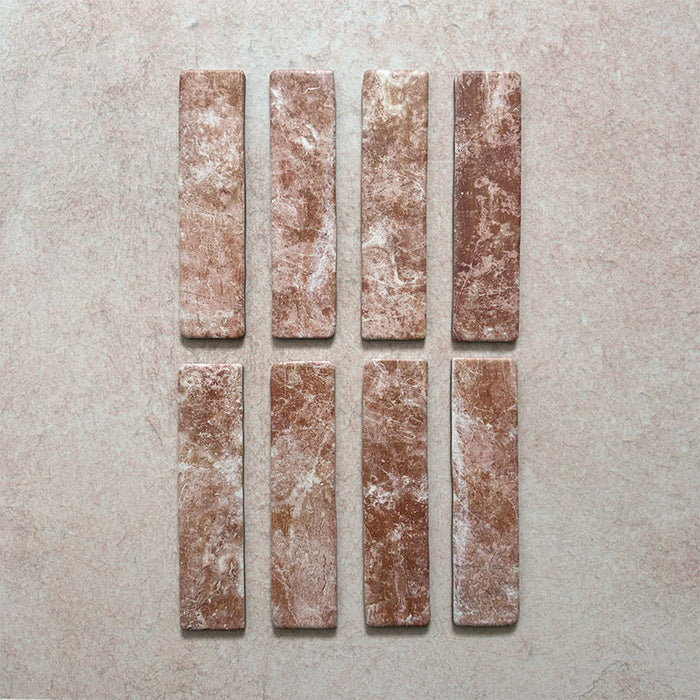 Product image of Giovanni Brick Rouge Vintage Marble wall and floor tiles in a 5.4cm x 22cm format, featuring warm blush pink marble effect detailing, natural tonal variation and rounded vintage-inspired edges.