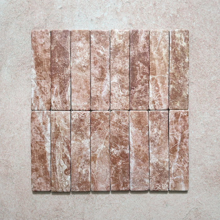 Product image of Giovanni Brick Rouge Vintage Marble wall and floor tiles in a 5.4cm x 22cm format, featuring warm blush pink marble effect detailing, natural tonal variation and rounded vintage-inspired edges.