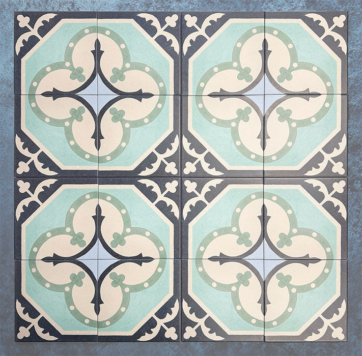 Group of Europa Gothenberg 20x20cm Victorian Moroccan style tiles arranged together to showcase the repeating geometric pattern in blue, mint green and cream tones, displayed against a textured blue background.