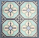 Group of Europa Gothenberg 20x20cm Victorian Moroccan style tiles arranged together to showcase the repeating geometric pattern in blue, mint green and cream tones, displayed against a textured blue background.