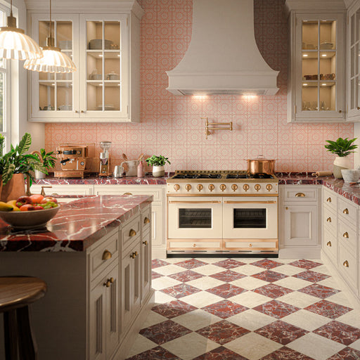 Elegant kitchen featuring Grand Bazaar Levant Rouge Matt 30x30cm marble-effect chequerboard floor tiles, with rich burgundy and cream tones arranged in a classic diagonal pattern, paired with pink Moroccan-style patterned splashback tiles, cream cabinetry, burgundy marble-effect worktops and brass fittings.