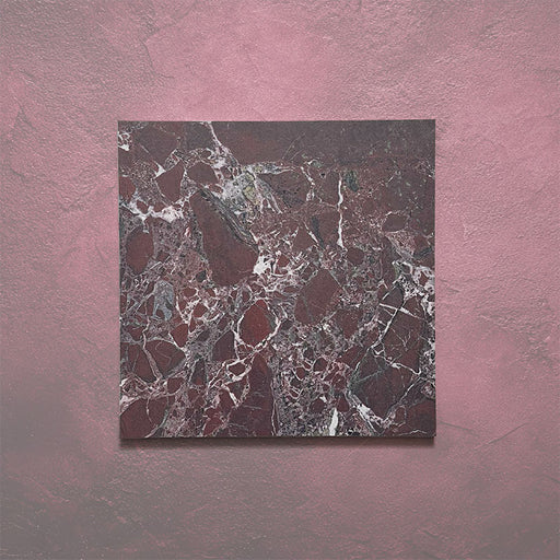 Close-up of Grand Bazaar Levant Rouge matt marble-effect tile in a 30cm x 30cm format, featuring deep burgundy and rich red tones with intricate white and grey marble-inspired veining. The dramatic colour variation and bold natural stone effect make it ideal for creating statement chequerboard floors and luxurious interior spaces.