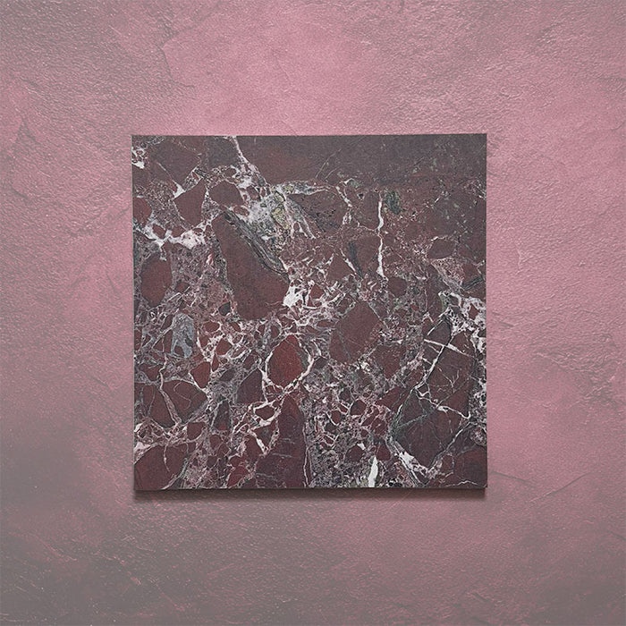 Close-up of Grand Bazaar Levant Rouge matt marble-effect tile in a 30cm x 30cm format, featuring deep burgundy and rich red tones with intricate white and grey marble-inspired veining. The dramatic colour variation and bold natural stone effect make it ideal for creating statement chequerboard floors and luxurious interior spaces.