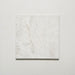 Close-up of Grand Bazaar Mahal matt marble-effect tile in a 30cm x 30cm format, featuring soft white and light grey tones with subtle natural stone-inspired movement and delicate veining. The understated marble effect creates a timeless, elegant finish, making it ideal for chequerboard floor designs, bathrooms, hallways and classic interior schemes.