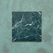Close-up of Grand Bazaar Verde Green matt marble-effect tile in a 30cm x 30cm format, featuring deep green tones with striking white marble-inspired veining and natural stone-effect variation. The rich colour and dramatic pattern create a bold, luxurious finish, ideal for statement chequerboard floors, feature areas and characterful interior spaces.