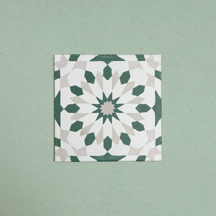 Soukaina Green A 20cm x 20cm Moroccan-style patterned porcelain tile, featuring a geometric star design in soft green, off-white and warm neutral tones with a matt finish.
