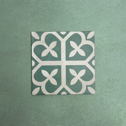 Iris Green Victorian Moroccan-style 20×20cm ceramic tile featuring a soft green and cream geometric pattern, ideal for adding decorative interest to floors and walls in both classic and contemporary interiors.