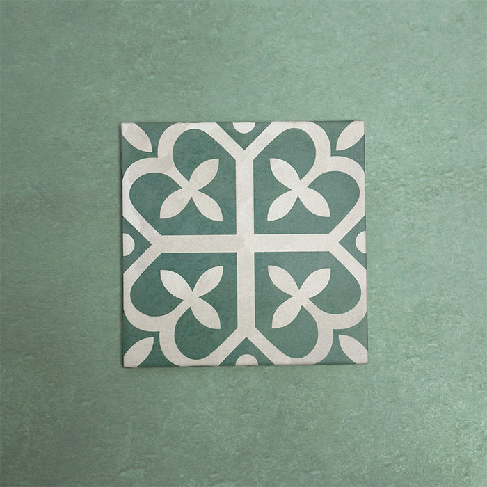 Iris Green Victorian Moroccan-style 20×20cm ceramic tile featuring a soft green and cream geometric pattern, ideal for adding decorative interest to floors and walls in both classic and contemporary interiors.