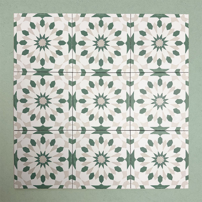 Group of Soukaina Green A Moroccan-style 20cm x 20cm patterned porcelain tiles, displaying a repeating geometric star motif in soft green, white and neutral tones with a matt finish.