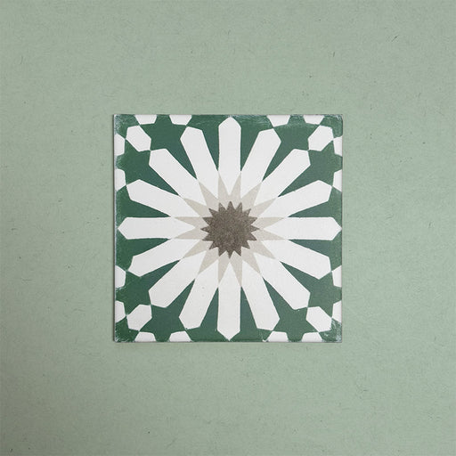 Soukaina Green B 20cm x 20cm Moroccan-style patterned porcelain tile, featuring a bold geometric star motif in deep green, white and warm neutral tones with a matt finish.