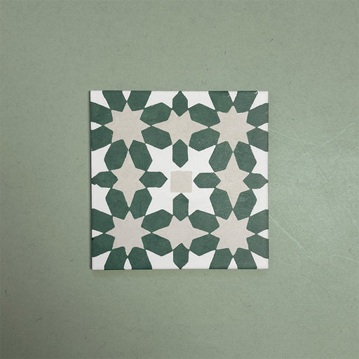 Soukaina Green C 20cm x 20cm Moroccan-style patterned porcelain tile, featuring a repeating geometric star motif in deep green and soft neutral tones with a matt finish.