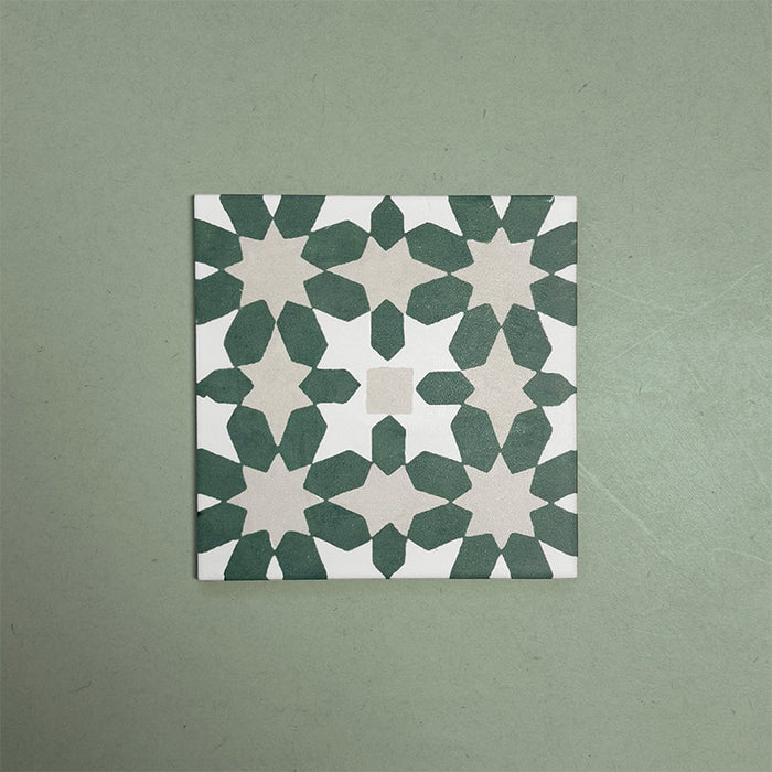 Soukaina Green C 20cm x 20cm Moroccan-style patterned porcelain tile, featuring a repeating geometric star motif in deep green and soft neutral tones with a matt finish.