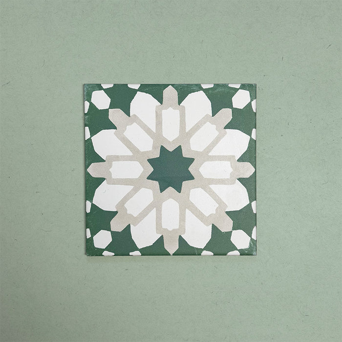 Soukaina Green D 20cm x 20cm Moroccan-style patterned porcelain tile, featuring a bold central star motif in deep green, white and soft neutral tones with a matt finish.
