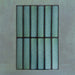 Group of Chemistry Green 6.5cm x 30cm rectangular ceramic wall tiles, showcasing a glossy crackle-effect glaze in rich green tones with an artisan, handcrafted effect finish.