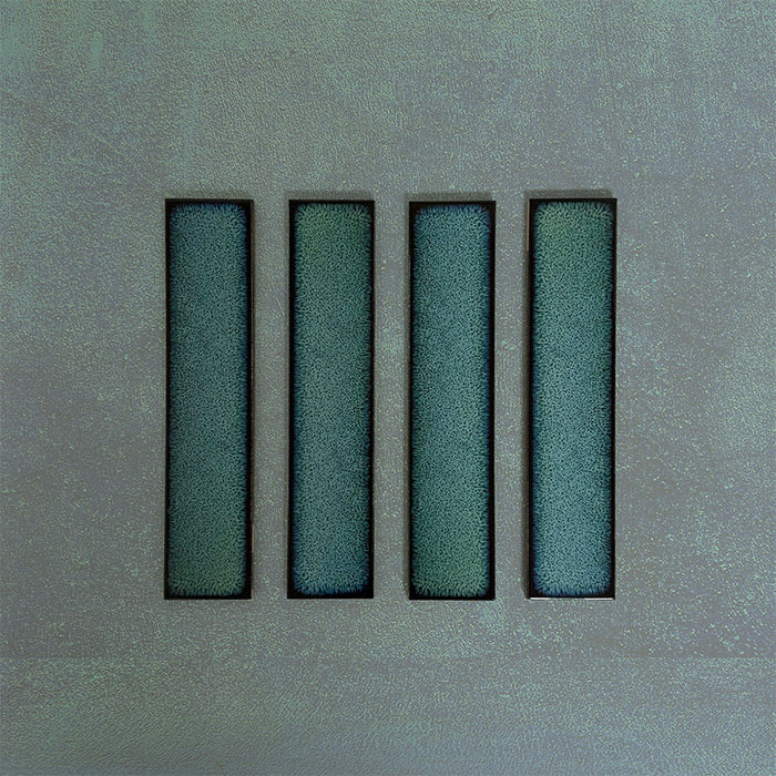 Group of Chemistry Green 6.5cm x 30cm rectangular ceramic wall tiles, showcasing a glossy crackle-effect glaze in rich green tones with an artisan, handcrafted effect finish.