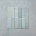 Zellij Aqua Blue brick tiles, 6.5cm x 20cm, Moroccan style, soft aqua blue tones with subtle tonal variation, glazed finish, rectangular brick format, arranged as a flat lay group of tiles.