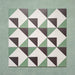 Group layout of Geometry Angles Patterned Tiles in 20cm x 20cm, arranged in a repeating geometric pattern featuring green, white, and black triangular shapes forming interlocking diamond motifs, displayed on a textured green background.