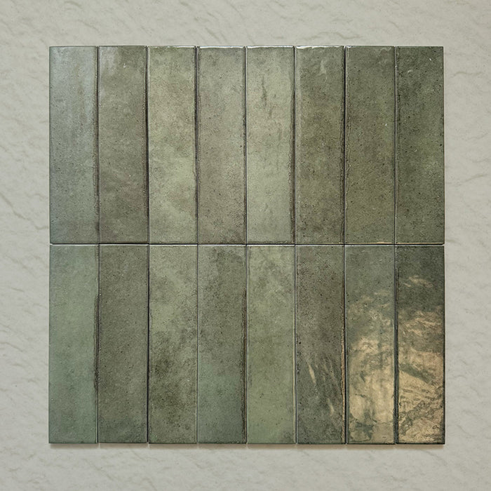 Madison Sage Green Brick Wall Tiles 6x24.6cm — group image showing the tile’s rich tonal variations and handcrafted finish. The blend of deep and soft sage hues, paired with a glossy surface, gives these tiles an organic, nature-inspired look perfect for adding warmth and texture to any space.