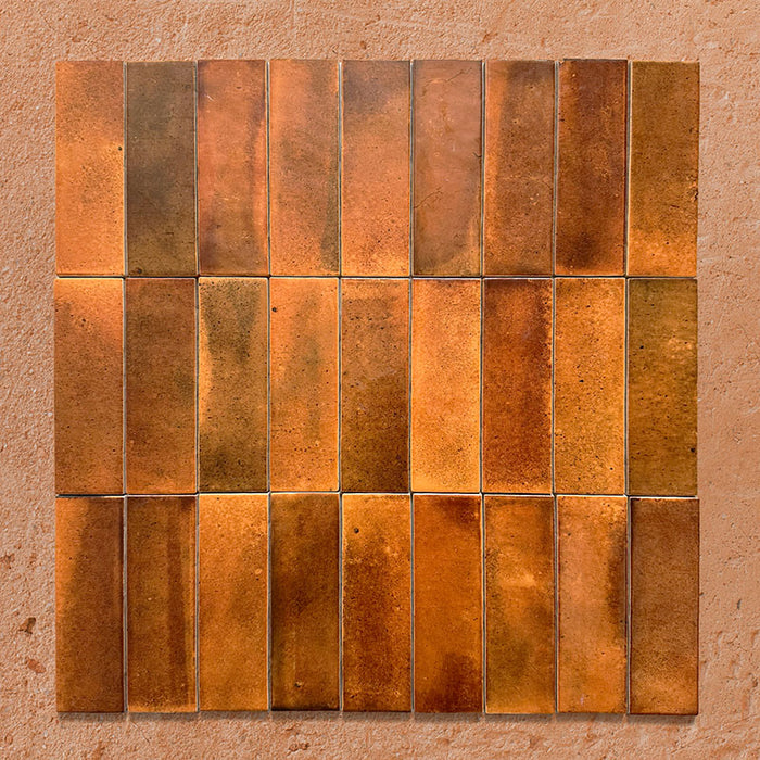 Beijing Amber Brick 5.1x16.1cm Moroccan-style ceramic wall tiles, styled in a grouped layout to showcase their rich amber tones and glossy handcrafted glaze.