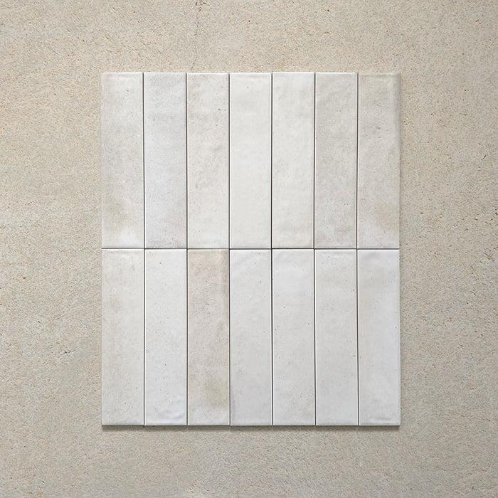 Izmir Brick Blanco Gloss Wall Tiles 6x25cm — group image showcasing the soft variations in tone and handcrafted texture. The glossy white surface adds depth and light, creating a bright yet characterful finish perfect for kitchens, bathrooms, and feature walls.