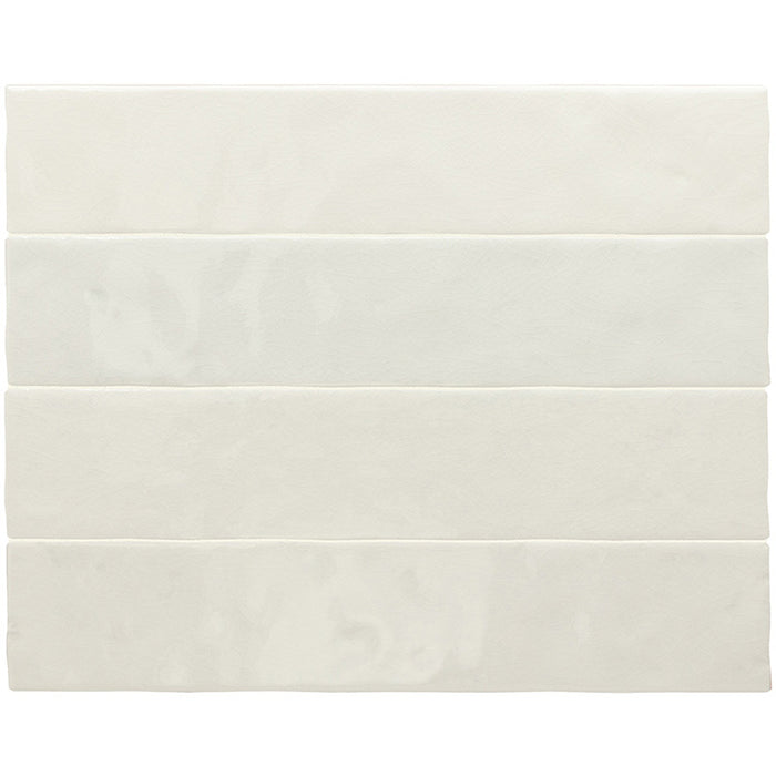 Malaga White Sand Brick gloss ceramic wall tiles in a 6.5 × 32.8cm format, shown grouped together to highlight their soft white colour, subtle variation and brick-style shape.