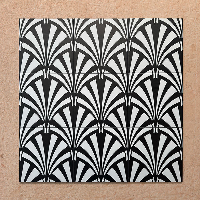 Alhambra Casa 20x20cm Moroccan tiles arranged in a group layout, showcasing their striking black and white fan-shaped Art Deco design on a warm neutral background, ideal for statement walls or feature floors.