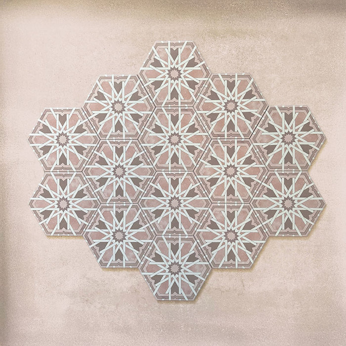 Maroush Mareshan Rose 18.7x21.6cm Moroccan hexagonal tiles arranged in a group layout, showcasing an intricate white starburst pattern on soft rose pink backgrounds for a refined geometric look.