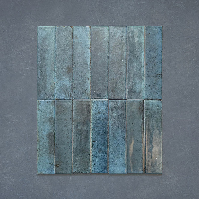 Izmir Brick Blue Gloss 6x25cm — group of tiles.
This rich blue palette combines moody marine tones with a glossy, handcrafted finish for a strikingly elegant effect. Each tile features subtle shade variation and surface depth, bringing texture and personality to kitchens, bathrooms, or statement feature walls.
