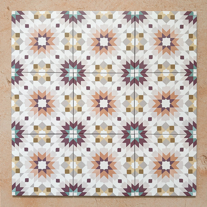 Cabana Manzanillo 20x20cm Moroccan-style porcelain tiles arranged in a repeating geometric star pattern featuring blush pink, mustard, terracotta, lilac, and turquoise tones with a matt finish on a neutral background
