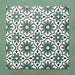 Flatlay featuring a group of Clarence House Verde Green 20x20cm Victorian Moroccan-style porcelain tiles, displaying a repeating geometric floral pattern in deep green, white, and black on a textured green background.