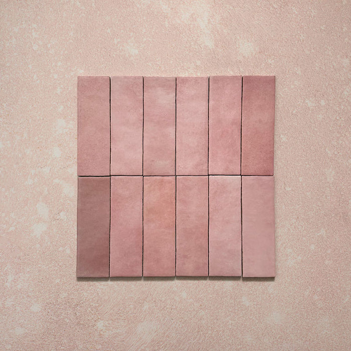 Zellij Rose Pink Brick tiles, 6.5cm x 20cm, brick format layout, soft rose pink and dusty blush tones with subtle tonal variation, smooth glazed finish, Moroccan-inspired design, group of tiles displayed.