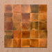 Beijing Amber Square 10x10cm Moroccan-style ceramic wall tiles, styled in a grouped layout to showcase their warm amber tones and glossy handcrafted texture.