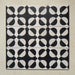 Group image showing multiple Geometry Illusion Noir 20x20cm geometric patterned tiles arranged in a repeating layout, featuring bold black and cream semicircles forming a striking symmetrical pattern, photographed against a textured neutral background.