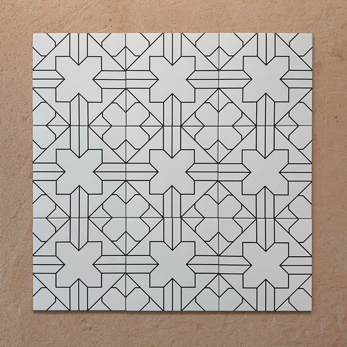 Alhambra Palacio 20x20cm Moroccan tiles displayed in a grouped layout, featuring a refined black geometric cross pattern on a crisp white background for a timeless, elegant look.