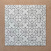 Alhambra Palacio 20x20cm Moroccan tiles displayed in a grouped layout, featuring a refined black geometric cross pattern on a crisp white background for a timeless, elegant look.