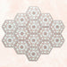 Maroush Dusty Pink 18.7x21.6cm Moroccan hexagonal tiles arranged in a group, displaying a detailed floral star pattern in soft pink and white against a pale marble-effect background.