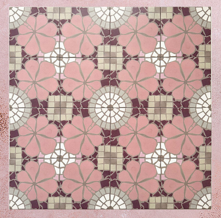 Group of Bloom Rose Pink 20x20cm Moroccan-style ceramic tiles arranged together, showcasing a repeating floral pattern in blush pink, burgundy, taupe, and white tones on a soft pink background.