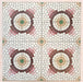Cabana La Calle 20x20cm Moroccan-style porcelain tiles shown as a group of four, featuring a mosaic-effect circular design in cream, blush, burgundy, green, and beige tones on a softly textured pink background.