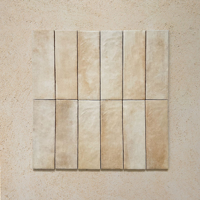Zellij Arena Brick Moroccan Style 6.5cm x 20cm group of tiles, rectangular brick tiles arranged in a grid, warm sandy beige and soft cream tones with natural tonal variation, lightly textured glazed finish, Moroccan-inspired handmade look suitable for walls and splashbacks.