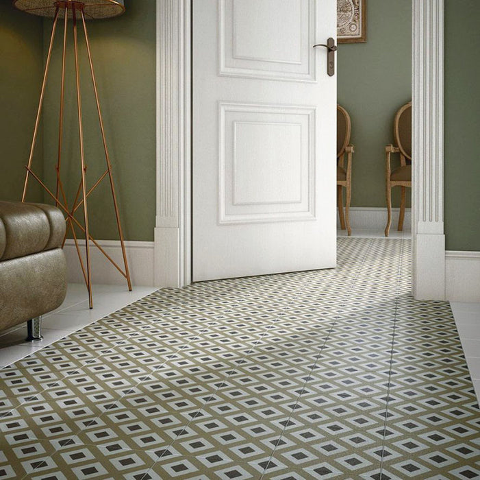 Hallway featuring Carnaby Park Road Victorian-style 20x20cm porcelain wall and floor tiles, showcasing a repeating diamond geometric pattern in olive, taupe, and white tones, styled with classic white door frames, green walls, and traditional wooden chairs.