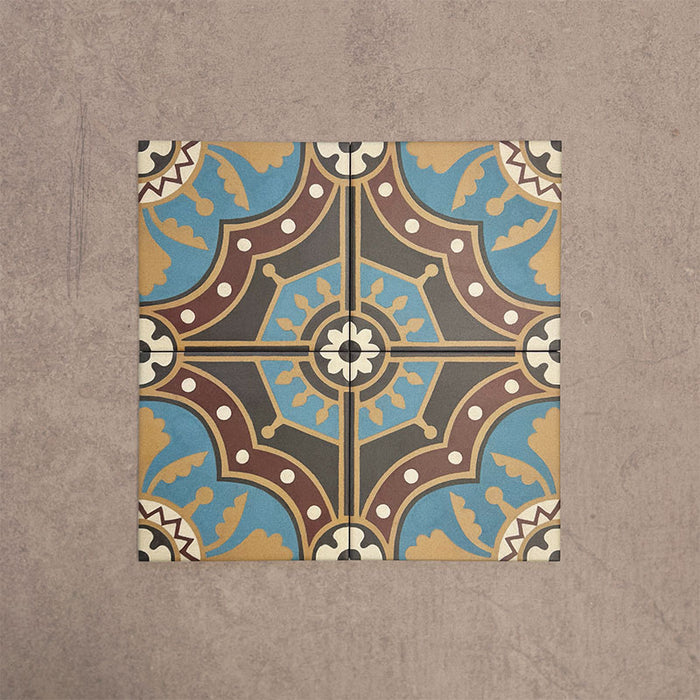 Four Europa Hanover 20x20cm Victorian Moroccan style tiles arranged together to showcase the repeating decorative pattern in blue, terracotta, mustard and cream tones, displayed against a textured beige background.