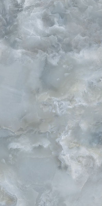 Close-up of Thebes Blue Honed Matt Onyx 60x120cm porcelain tile featuring soft blue onyx-effect veining with layered white, grey and pale blue tones. The honed matt finish creates a luxurious natural stone look, perfect for bathroom walls, feature walls and elegant interiors.
