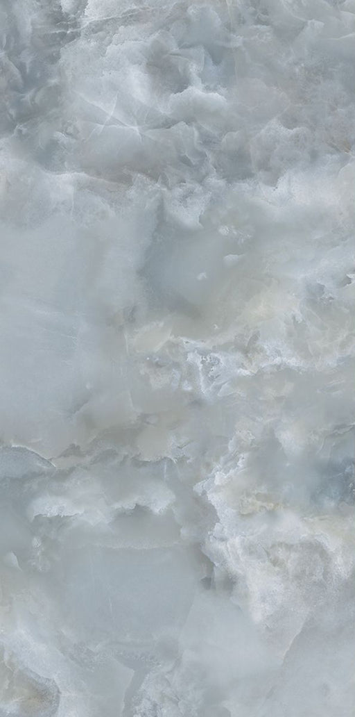 Close-up of Thebes Blue Honed Matt Onyx 60x120cm porcelain tile featuring soft blue onyx-effect veining with layered white, grey and pale blue tones. The honed matt finish creates a luxurious natural stone look, perfect for bathroom walls, feature walls and elegant interiors.