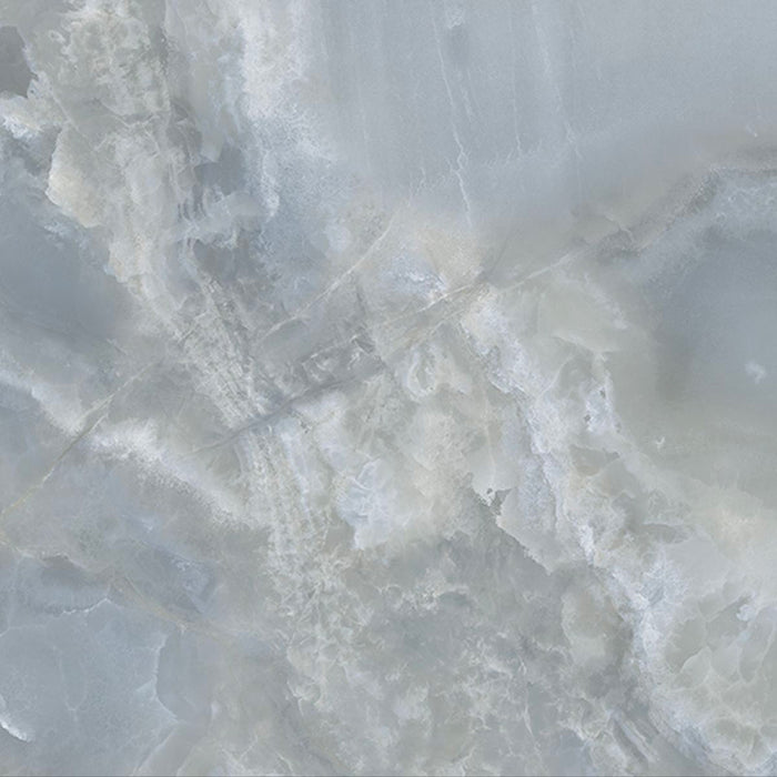 Close-up of Hashim Blue Honed Matt Onyx 60x60cm porcelain tile featuring soft blue onyx-effect veining with layered white, grey and pale blue tones. The honed matt finish creates a luxurious natural stone look, perfect for bathroom walls, feature walls and elegant interiors.