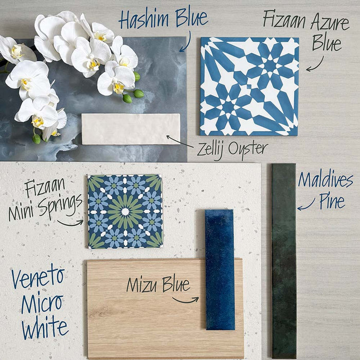 Flat lay moodboard featuring Hashim Blue Honed Matt Onyx tiles paired with blue Moroccan style patterned tiles, deep blue gloss brick tiles, dark green wall tiles, soft white metro tiles and light wood accents, creating a fresh, elegant bathroom design scheme.